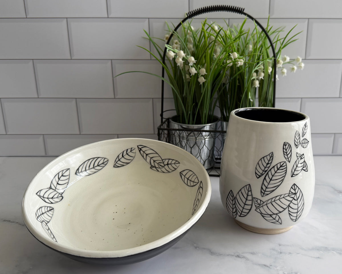 Matching vase and bowl with illustrated leaves