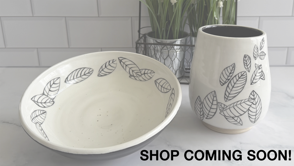 Matching vase and bowl with illustrated leaves